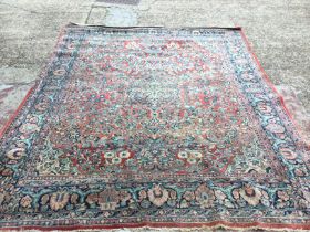 A large hand knotted rug, approximate dimensions 300x240cm postage category D