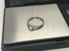 An 18ct white gold princess cut solitaire with dia