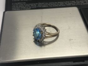 A 9ct gold diamond cluster and blue stone ring, 45