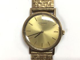 A 9ct longines watch from circa 1970s. Winds and r