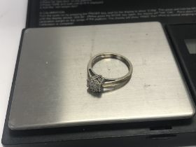 An 18ct white gold diamond cluster ring .25cts. 3.