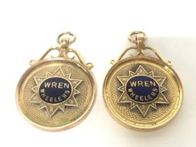 A pair of 9ct gold and enamel Wren Wheelers bicycl