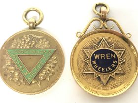 A pair of 9ct gold and enamel cycling medals inclu