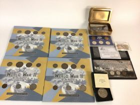 Four World War II remembered coin packs. First Wor