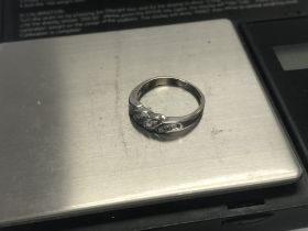 10kt white gold 12 stone diamond set ring 25pts. A