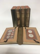 Four albums containing 1974 proof Cook Island silv