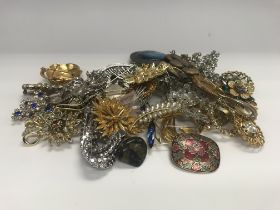 A collection of brooches.