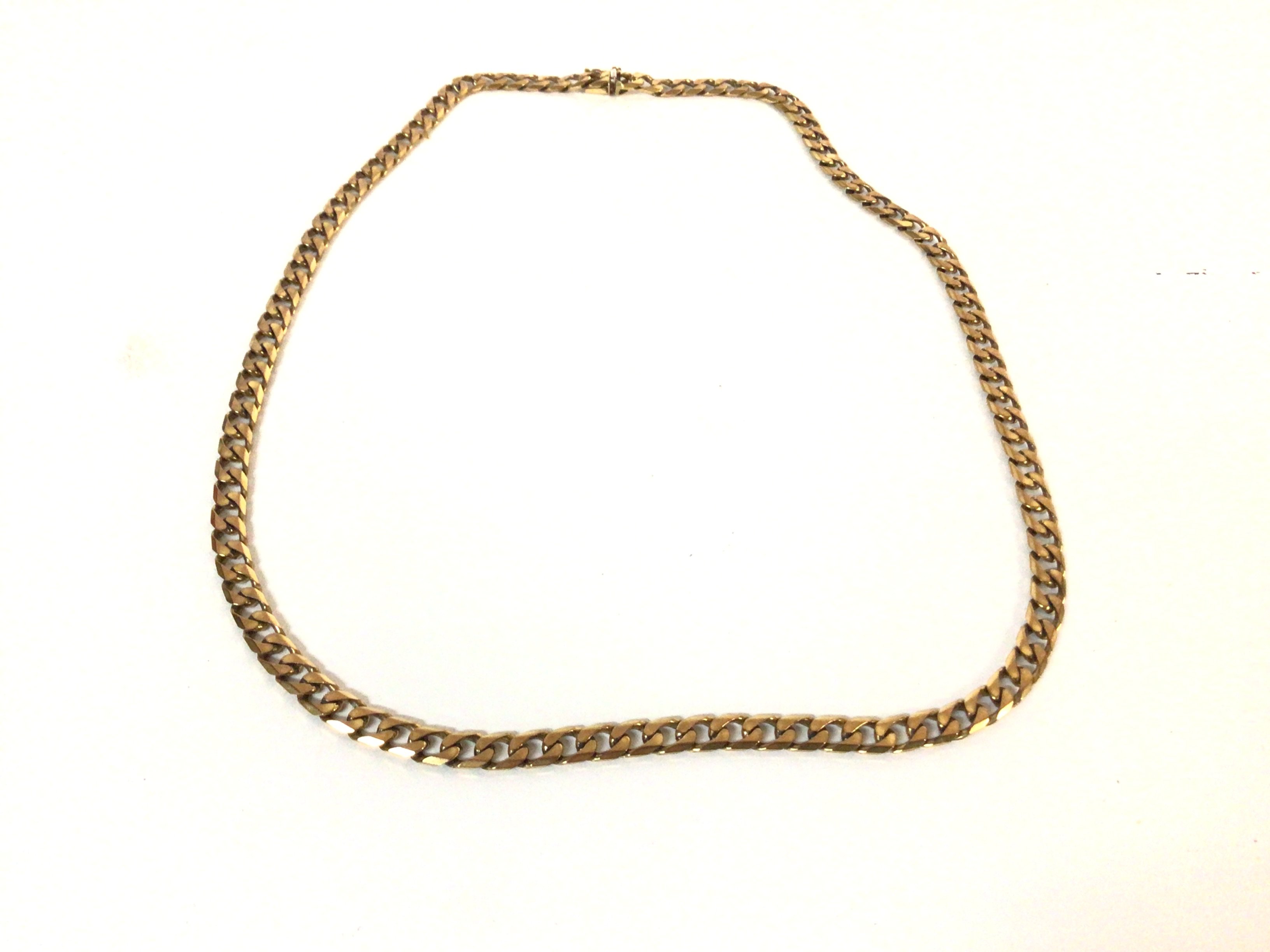 A 9ct gold cuban chain. Total weight 46.5g and 61c