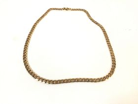 A 9ct gold cuban chain. Total weight 46.5g and 61c