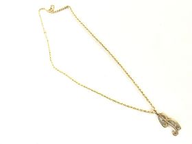 A 9ct gold rope chain with B pendant , 5.2g. Posta