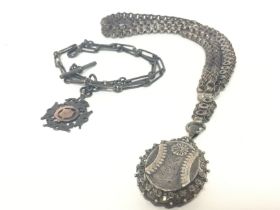 A vintage silver watch chain and a late Victorian