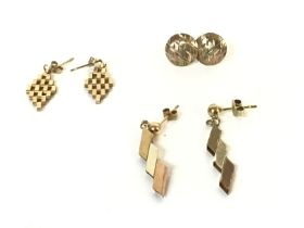 Three pairs of 9k gold earrings. 3.32g Postage A