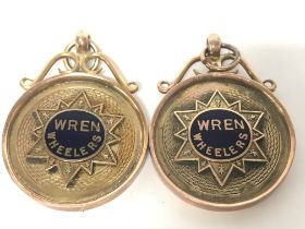 A pair of 9ct gold and enamel Wren Wheelers 25 mil