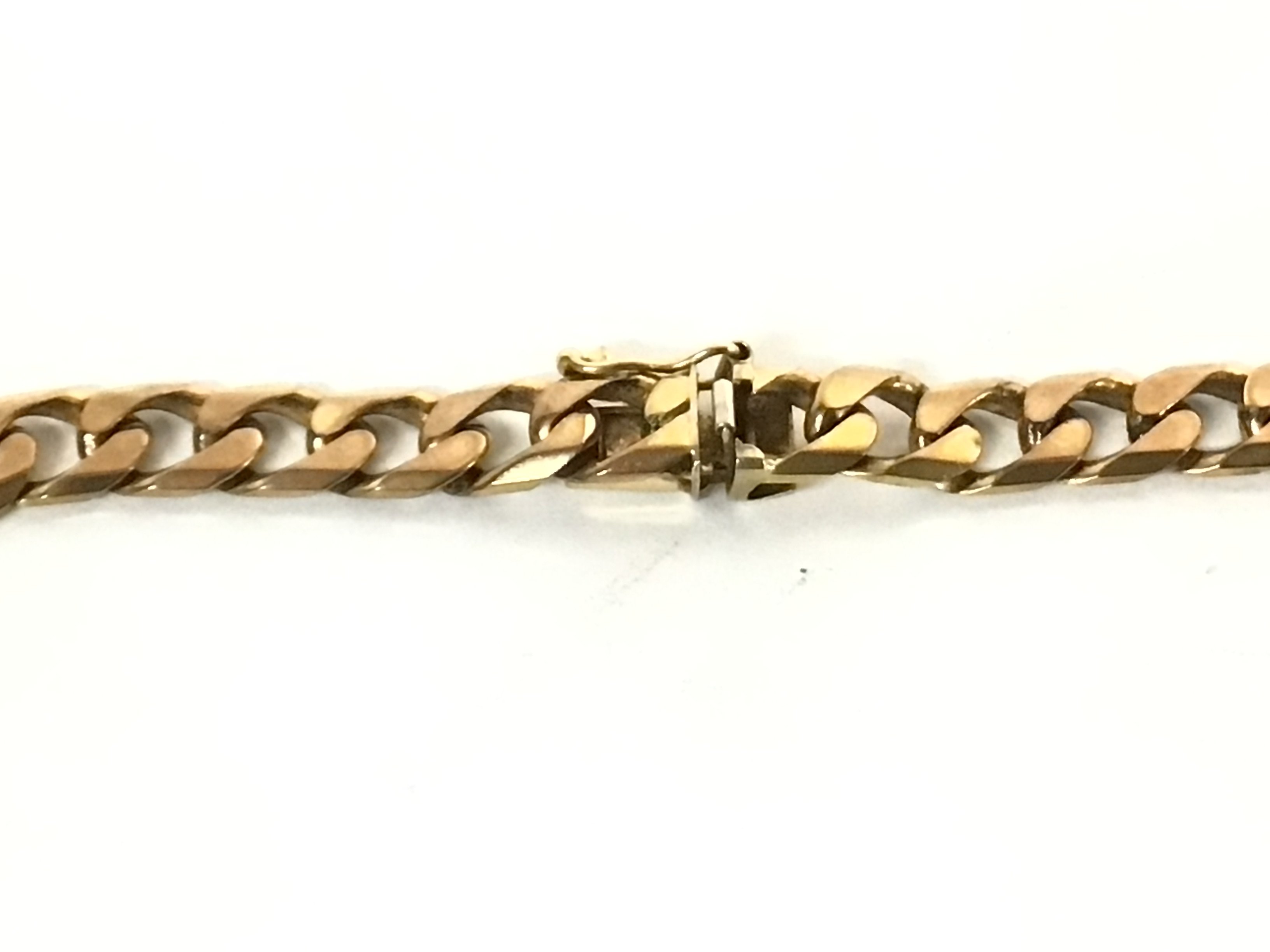 A 9ct gold cuban chain. Total weight 46.5g and 61c - Image 2 of 3