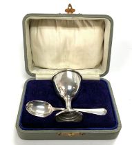 A cased hallmarked silver egg cup and matching spo