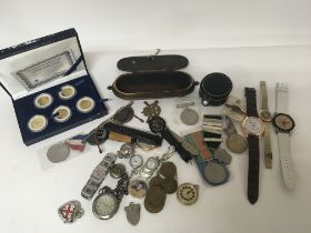 A collection of watches II world war medals other medal coins stamps and other ornaments (a lot)