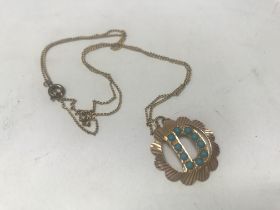 A 14kt turquoise pendant and chain, approx 3.3 gra