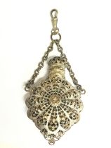 An enamel perfume bottle on a small chain , postag