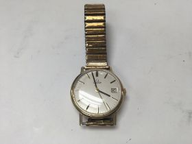 A 9ct gold manual omega date just, seen working.