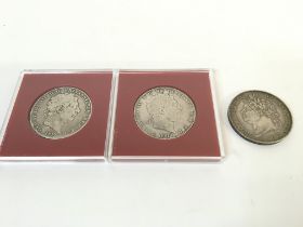 Two George III 1819 crowns and a 1821 George IV si