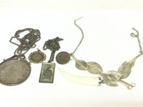 A collection of silver jewellery including chains