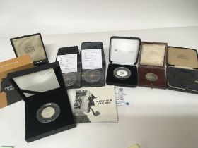 Two 9carat gold coins Jubilee Mint Sherlock Holmes cased silver proof coin Euro2000 coin and other