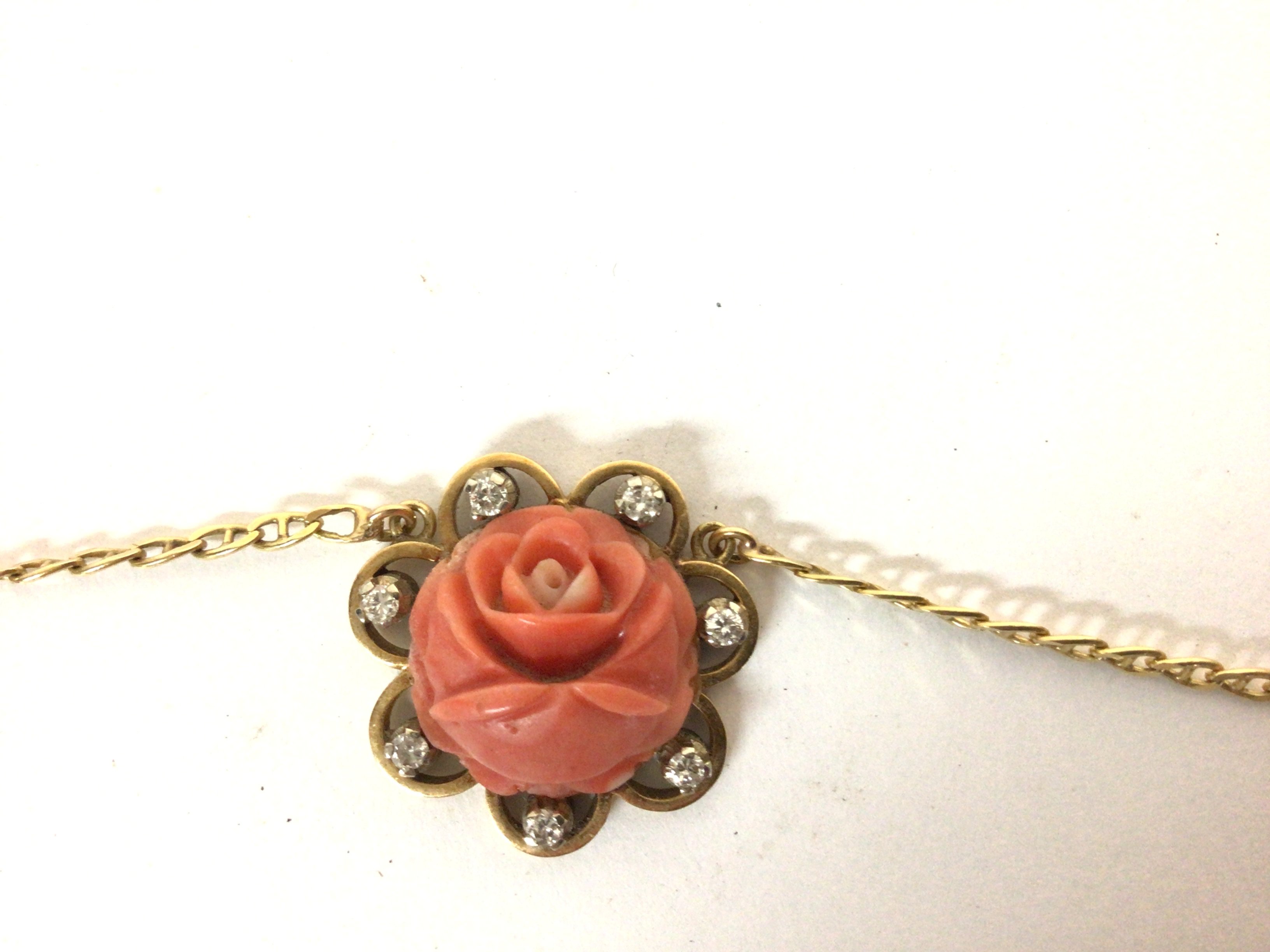 A coral and diamond pendant on a chain. Both marke - Image 4 of 4