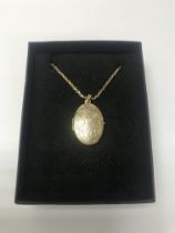 A 9ct gold chain and locket, approx 7.82 grams.