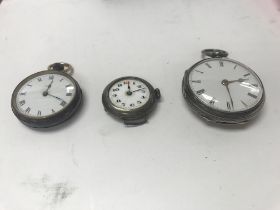 Three silver pocket watches.