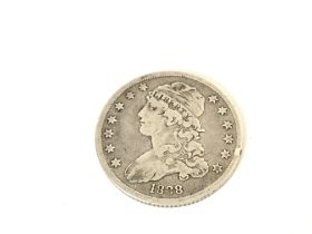 A 1838 Silver Capped Bust 25 cents coin. Postage A