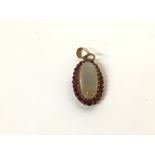 9ct gold pendant set with Rubies and moonstone. Ap