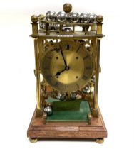 A Harding & Bazeley modern spherical weight clock,