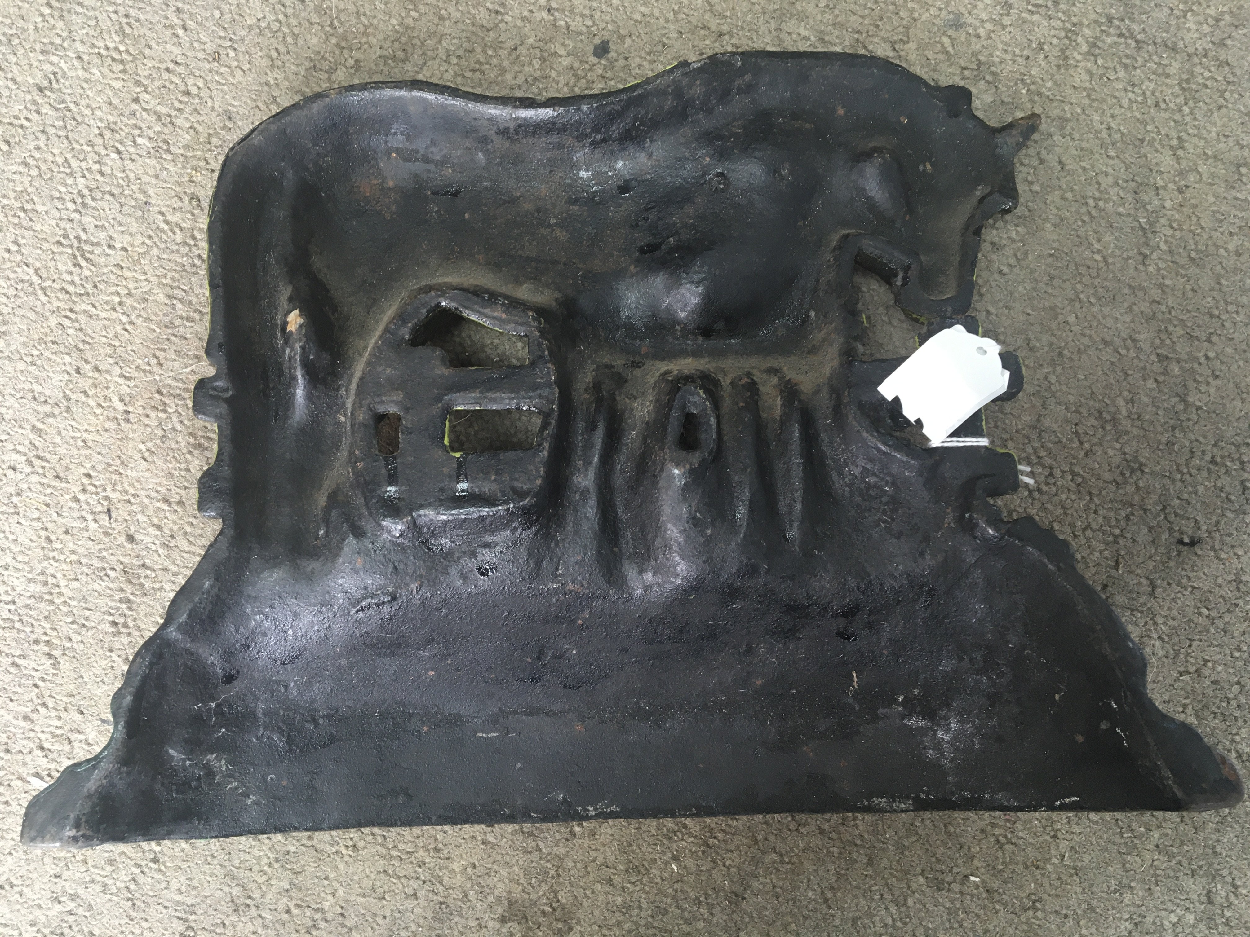 A Victorian cast iron door stop in the form a Mare