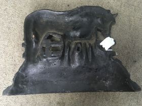 A Victorian cast iron door stop in the form a Mare