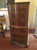 A small walnut chest on chest fitted with six serp