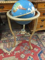 A gem stone globe brass stand .