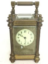 An ornate brass and carriage clock, dimensions 8x9