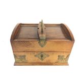An oak writing box. 31cm wide 25deep and 21cm high