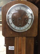 Two oak grandmother clocks.