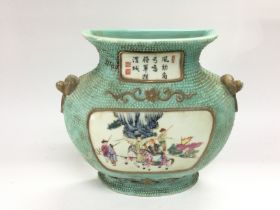 An Oriental wall vase with hand painted decoration