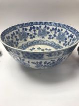 Two ceramic bowls along with a collection of glass