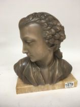 A painted plaster bust on a marble base height 31c