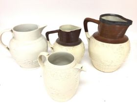 A collection of jugs including 3 Turner jugs and a