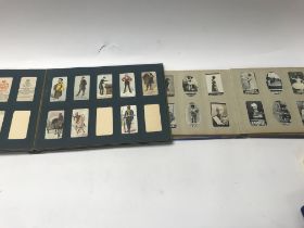 Three albums of mixed cigarette cards including gu