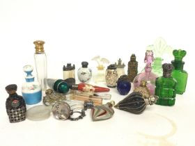 A collection of various vintage perfume bottles in