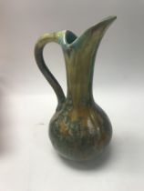 A French pottery pierrefonds glazed jug. Height ap