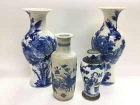 Four blue and white vases comprising a pair decora