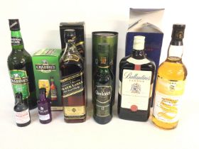 A collection of spirits including a bottle of Milt