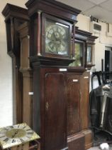 An oak Eight Day long case clock, with brass dial