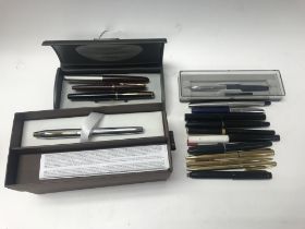 A collection of fountain pens as well as Parker pe